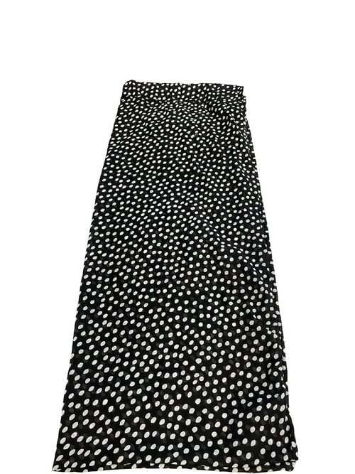 Black skirt with white polka dot pattern on a white background